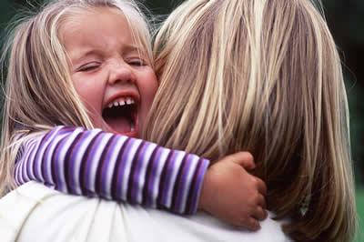 hugging-child-laughing.jpg