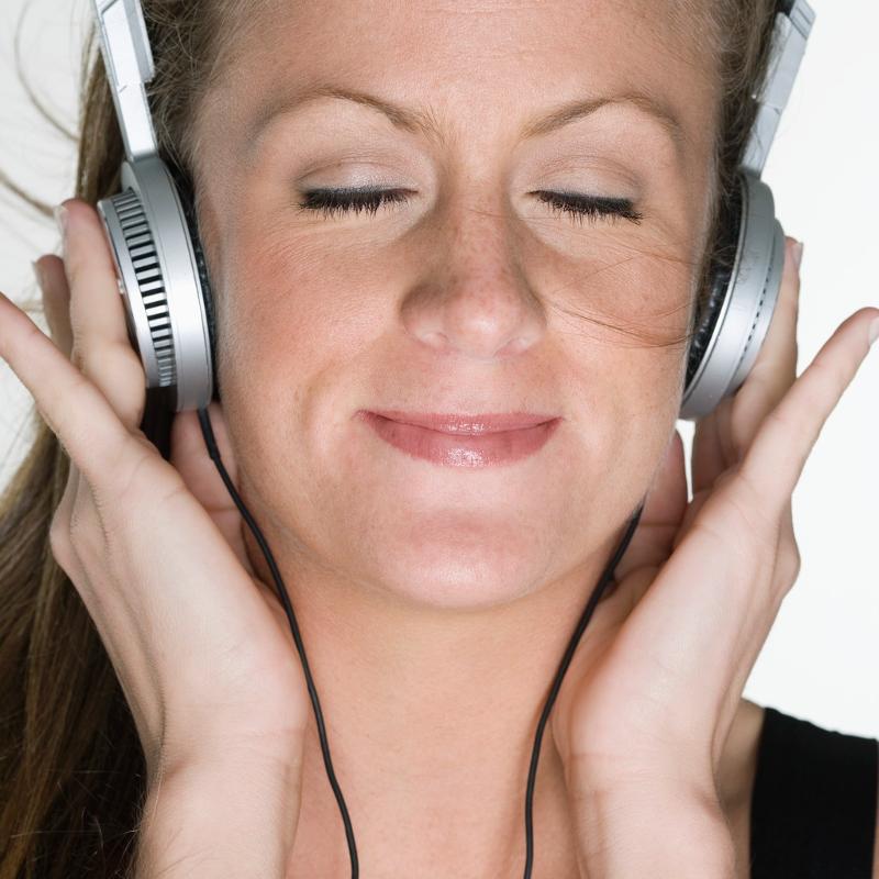 Woman Listening to Hypnosis CD